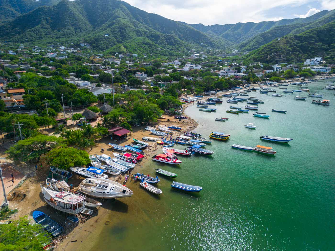 people boarding boat playa taganga colombia