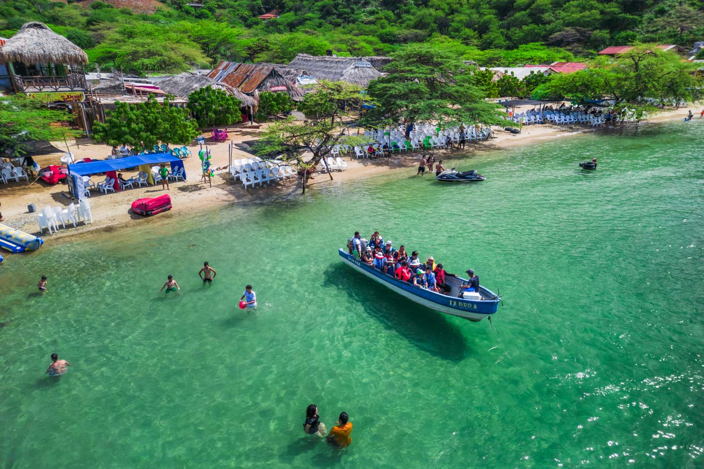 taxi boat leaving playa grande santa marta